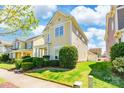 A charming two-story home showcases its well-maintained lawn and inviting curb appeal at 16431 Leavitt Ln, Davidson, NC 28036