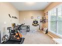 Versatile home office space with ample natural light and carpeted floors at 16431 Leavitt Ln, Davidson, NC 28036