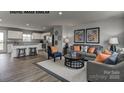 Stylish living room featuring modern decor, comfortable seating, and an open floor plan that connects to the kitchen at 169 Basildon St # 1012, Lancaster, SC 29720