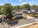 An aerial view of the neighborhood showcasing the home's location, nearby houses, and tree-lined streets at 207 Kerr Nw St, Concord, NC 28025