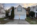 Charming home with an attached two car garage and appealing facade at 2125 Arbor Vista Dr, Charlotte, NC 28262