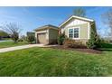 Charming single-story home featuring a one-car garage, well-manicured lawn and landscaping at 314 Flat Rock Dr, Denver, NC 28037