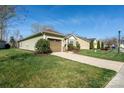 Charming home featuring a one car garage and an inviting walkway up to the front door at 314 Flat Rock Dr, Denver, NC 28037