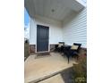 Inviting front porch featuring comfortable seating, stylish brick accents, and an eye-catching welcome mat at 314 Olympia Way, York, SC 29745