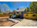 Charming single-story home with a well-manicured lawn, fence, and stylish curb appeal at 4429 Major St, Charlotte, NC 28208