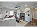 Inviting living room featuring a fireplace, built-in shelves, and a cozy seating area at 4429 Major St, Charlotte, NC 28208