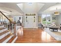 Inviting foyer featuring hardwood floors, a staircase, and a soaring ceiling at 516 White Tail Ter, Waxhaw, NC 28173