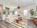 Bright and airy living room with modern decor and hardwood floors at 533 Cedar Knoll Cir, Pineville, NC 28134