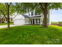 Inviting two-story home with lush green lawn and mature trees at 5549 Lemley Nw Rd, Concord, NC 28027