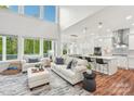 Bright, open-concept living room flows into modern kitchen with stainless steel appliances and ample counter space at 6006 Waxhaw Crossing Dr, Waxhaw, NC 28173