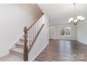 Inviting foyer features wood-look floors, a staircase with white railing, and ample natural light at 609 Sweet Bonnie Ln, Belmont, NC 28012