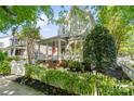 An inviting two-story home featuring a quaint front porch and a classic white picket fence at 6165 Caseys Side Way, Fort Mill, SC 29708
