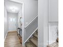 Bright entryway features wood flooring, a staircase, and access to other areas of the home at 6563 Kinder Ln, Lancaster, SC 29720