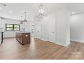 Spacious and bright open floor plan showcases the kitchen and dining area at 710 Falling Oak Aly # 17, Huntersville, NC 28078