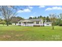 Ranch home with covered front porch, mature trees, and a large front yard offering curb appeal and outdoor space at 775 Bolick Rd, Fort Mill, SC 29707