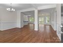 Spacious living room features hardwood floors, large windows with natural light, and decorative trim at 869 Kathryn Se Dr, Concord, NC 28025
