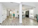 Open concept dining room and kitchen with gray floors, white walls and plenty of natural light at 1432 Deer Forest Dr, Fort Mill, SC 29707