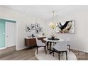 An elegant dining room featuring a chandelier and neutral tones for stylish entertaining at 19725 Deer Valley Dr, Cornelius, NC 28031