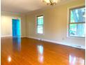 Bright living room with hardwood floors, fresh paint, and lots of natural light at 211 Worthington St, Shelby, NC 28150