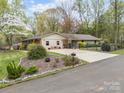 Attractive single-story home featuring neutral siding, a well-kept lawn and mature landscaping at 2600 Gemway Dr, Charlotte, NC 28216