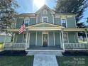 Classic home with a cozy front porch perfect for relaxing and curb appeal at 501 E Lafayette St, Salisbury, NC 28144