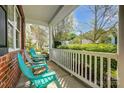 Inviting front porch with comfortable seating, white railing, and lush greenery, perfect for relaxation at 517 Bertram Rd, Fort Mill, SC 29708