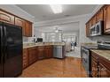 Kitchen with stainless steel appliances, wood cabinets, and granite countertops at 5216 Berkeley View Cir, Charlotte, NC 28277