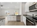 Modern kitchen featuring stainless steel appliances, granite countertops, and ample cabinet space at 5711 Skinny Down, Charlotte, NC 28215