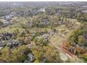 Overhead view of a property surrounded by lush greenery and a golf course, offering scenic living at 10 North Rd, Salisbury, NC 28144