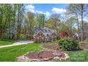 Beautiful brick home with meticulously maintained front yard at 125 Cove Creek Loop # 18, Mooresville, NC 28117