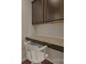 Desk nook with granite countertop, upper cabinets and a white chair at 13311 Union Square Dr, Huntersville, NC 28078
