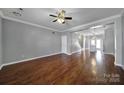 Inviting living area showcasing hardwood floors, crown molding, and an open layout to the kitchen at 13376 Calloway Glen Dr, Charlotte, NC 28273