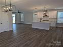 Inviting living space with a modern kitchen featuring an island, stainless steel appliances and open floor plan at 1939 Hendricks St, Rock Hill, SC 29732