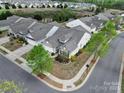Overhead view of home and neighborhood showing the manicured lawn, landscaping, and surrounding neighborhood at 20202 Dovekie Ln, Indian Land, SC 29707