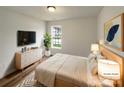 Virtually staged bedroom featuring modern furniture, a large window, and neutral decor to show off the spacious layout at 4147 Timberwood Dr, Gastonia, NC 28056