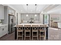 Spacious kitchen with gray cabinets, stainless steel appliances, and a center island with seating at 4195 Island Fox Ln, Denver, NC 28037