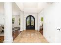 Elegant foyer with tile flooring, a decorative front door, and views into the dining and living spaces at 4904 Ardenetti Ct, Mint Hill, NC 28227