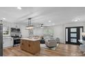 Bright open-concept living space boasts an island kitchen and modern furnishings at 4932 Delivau Dr, Charlotte, NC 28215