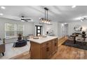 Bright open-concept living space boasts wood floors and modern furnishings at 4932 Delivau Dr, Charlotte, NC 28215