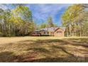 Charming single-story home featuring a well-maintained lawn and mature trees at 605 Ottawa Dr, Rock Hill, SC 29732