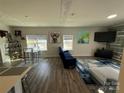 Stylish living room with modern decor, wood flooring, and ample natural light at 6499 Gopher Rd, Lancaster, SC 29720