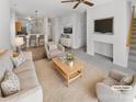 Bright living room with neutral tones, open to kitchen, and modern furnishings at 6525 Soapstone Dr, Charlotte, NC 28269