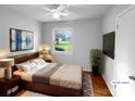 Cozy bedroom with natural light, modern decor, and hardwood flooring at 827 Ford Dr, Lowell, NC 28098