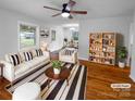 Comfortable living room with neutral decor, hardwood floors, and bright natural light at 827 Ford Dr, Lowell, NC 28098