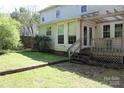 View of the grassy backyard featuring a patio with a pergola at 9915 Lottie Ln, Charlotte, NC 28262