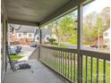 Relaxing porch view overlooking a quiet street and well-manicured lawns at 1022 Kenilworth Nw Ct, Concord, NC 28027