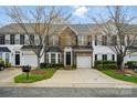 Brick townhome featuring a one-car garage and landscaped front yard at 125 Snead Rd # 60, Fort Mill, SC 29715