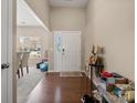 Inviting foyer with hardwood floors and natural light, creating a warm and welcoming entrance at 13510 Brandon Trail Dr, Charlotte, NC 28213