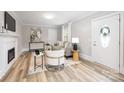 Bright living room with wood floors, fireplace, neutral colors, recessed lights and lots of natural light at 2414 Remount Rd, Charlotte, NC 28208