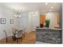 Cozy dining area with a round table and four chairs near the kitchen at 2934 Selwyn Ave, Charlotte, NC 28209
